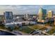 Attractive aerial view features city buildings next to the water and a green park at 777 N Ashley Dr # 2513, Tampa, FL 33602