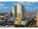 Striking aerial view shows the tall buildings towering over the cityscape under a clear blue sky at 777 N Ashley Dr # 2513, Tampa, FL 33602