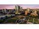 Elevated aerial view capturing a city's architecture, waterfront park, and surrounding greenery, offering a serene urban experience at 777 N Ashley Dr # 2513, Tampa, FL 33602