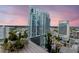 Cozy balcony with modern railing and potted plants, featuring views of the city skyline and nearby buildings at 777 N Ashley Dr # 2513, Tampa, FL 33602