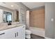 This bathroom showcases a granite vanity, modern fixtures, and a tiled shower, blending style and functionality at 777 N Ashley Dr # 2513, Tampa, FL 33602