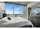 Bright bedroom with floor to ceiling windows showcasing the city skyline at 777 N Ashley Dr # 2513, Tampa, FL 33602