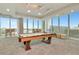 Bright game room with a pool table and expansive windows offering city views at 777 N Ashley Dr # 2513, Tampa, FL 33602