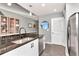 Well-appointed kitchen with stainless steel appliances, dark countertops, and ample cabinet space at 777 N Ashley Dr # 2513, Tampa, FL 33602