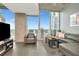 Inviting living room featuring floor-to-ceiling windows with balcony access, and comfortable seating at 777 N Ashley Dr # 2513, Tampa, FL 33602