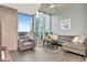 Cozy living room with large windows offering views of the cityscape, and ample natural light at 777 N Ashley Dr # 2513, Tampa, FL 33602
