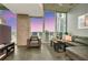 Bright living room with modern furnishings and floor to ceiling windows showcasing the city skyline at 777 N Ashley Dr # 2513, Tampa, FL 33602