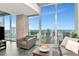 Bright living room with modern furnishings and floor to ceiling windows showcasing the city skyline at 777 N Ashley Dr # 2513, Tampa, FL 33602