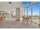 Relaxing residents lounge with multiple tables, seating, and large windows with a view at 777 N Ashley Dr # 2513, Tampa, FL 33602