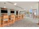 Relaxing residents lounge with multiple TVs, bar top, and seating, located on roof of building at 777 N Ashley Dr # 2513, Tampa, FL 33602