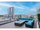 Stylish rooftop deck featuring a modern fire pit and comfortable seating arrangement at 777 N Ashley Dr # 2513, Tampa, FL 33602