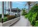 Serene rooftop deck with lush landscaping and a shaded walkway, ideal for relaxing strolls at 777 N Ashley Dr # 2513, Tampa, FL 33602