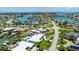 Expansive aerial view of a waterfront community, complete with boats, docks, and lush greenery at 7892 10Th S Ave, St Petersburg, FL 33707