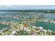 Stunning aerial shot of luxury waterfront homes with boat docks, reflecting an idyllic coastal community at 7892 10Th S Ave, St Petersburg, FL 33707