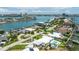 Scenic aerial view of a coastal community featuring houses, waterways, and lush vegetation at 7892 10Th S Ave, St Petersburg, FL 33707