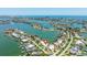 Stunning aerial view of a waterfront neighborhood featuring beautiful homes and access to canals and the open water at 7892 10Th S Ave, St Petersburg, FL 33707