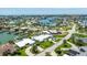 Scenic aerial view showcasing waterfront homes, lush greenery, and a coastal community with serene waterways at 7892 10Th S Ave, St Petersburg, FL 33707