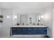 Modern bathroom featuring a double vanity with marble counters and plenty of storage space at 7892 10Th S Ave, St Petersburg, FL 33707