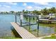 The property features a private dock with a boat lift for easy water access at 7892 10Th S Ave, St Petersburg, FL 33707