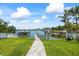 Dock and boat lift on the water provide direct access to the water at 7892 10Th S Ave, St Petersburg, FL 33707