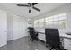 Contemporary home office with twin desks, comfortable chairs, ample natural light, and polished tile flooring at 7892 10Th S Ave, St Petersburg, FL 33707