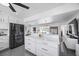 Bright open-concept kitchen with a large island, stainless steel appliances, and views to the living area at 7892 10Th S Ave, St Petersburg, FL 33707