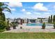 Inviting backyard pool with a gazebo, patio, and lush landscaping at 7892 10Th S Ave, St Petersburg, FL 33707