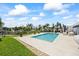 Backyard pool with stone patio, gazebo and dock in the distance at 7892 10Th S Ave, St Petersburg, FL 33707