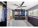 Expansive walk-in closet with custom shelving, organized clothing and accessories, and sleek, dark-stained wood at 7892 10Th S Ave, St Petersburg, FL 33707