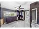This walk-in closet offers custom shelves, hanging racks, modern lighting, a large window, and ample storage at 7892 10Th S Ave, St Petersburg, FL 33707