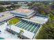 Aerial view of the shuffleboard courts, grass courtyard and building exteriors at the community recreation center at 8080 112Th St # 108, Seminole, FL 33772