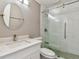 Bathroom with a glass shower door, modern mirror, and neutral colors at 8080 112Th St # 108, Seminole, FL 33772
