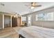 Bedroom featuring ceiling fan, wood floors, a closet, and lots of natural light at 8080 112Th St # 108, Seminole, FL 33772