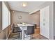 The dining area features a breakfast bar with seating and modern light fixture at 8080 112Th St # 108, Seminole, FL 33772