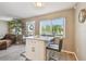 Breakfast bar with seating and large window to let in natural light at 8080 112Th St # 108, Seminole, FL 33772