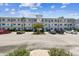 Exterior full view of the property shows a building, parking lot and landscaping at 8080 112Th St # 108, Seminole, FL 33772