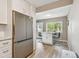Bright kitchen features stainless fridge and a central island with bar seating at 8080 112Th St # 108, Seminole, FL 33772