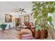 Living room featuring a leather sofa, accent chairs and plants at 8080 112Th St # 108, Seminole, FL 33772