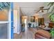 The living room is staged with modern furniture, neutral walls and a ceiling fan at 8080 112Th St # 108, Seminole, FL 33772