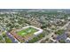 Bright aerial view of a residential community with pool and shuffleboard in a park-like setting at 8100 Dr Martin Luther King Jr N St # 202, St Petersburg, FL 33702