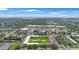 Aerial view of complex with pool and surrounding neighborhood and shopping center at 8100 Dr Martin Luther King Jr N St # 202, St Petersburg, FL 33702