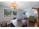Open concept dining area with hardwood floors and views of the living room; great for entertaining at 8100 Dr Martin Luther King Jr N St # 202, St Petersburg, FL 33702