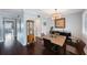 Well-appointed dining room with hardwood floors and access to other rooms in the home at 8100 Dr Martin Luther King Jr N St # 202, St Petersburg, FL 33702