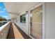 Inviting front door to unit 202, with a well-lit walkway and fresh paint at 8100 Dr Martin Luther King Jr N St # 202, St Petersburg, FL 33702