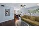 Comfortable living room with hardwood floors, ceiling fan, and plenty of natural light at 8100 Dr Martin Luther King Jr N St # 202, St Petersburg, FL 33702