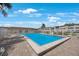 Inviting community pool surrounded by a fence and lounge chairs at 8100 Dr Martin Luther King Jr N St # 202, St Petersburg, FL 33702