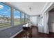 Bright sunroom featuring large windows with shutters at 8100 Dr Martin Luther King Jr N St # 202, St Petersburg, FL 33702