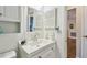 Bright bathroom features a modern sink and a decorative butterfly at 8447 Orleans N, Pinellas Park, FL 33781