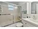 Clean bathroom featuring a glass enclosed shower and modern sink at 8447 Orleans N, Pinellas Park, FL 33781