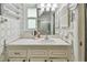 Bathroom features patterned wallpaper, a white vanity, and glass-enclosed shower at 8447 Orleans N, Pinellas Park, FL 33781